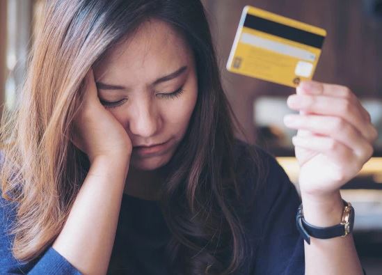 Person in Credit Card Debt